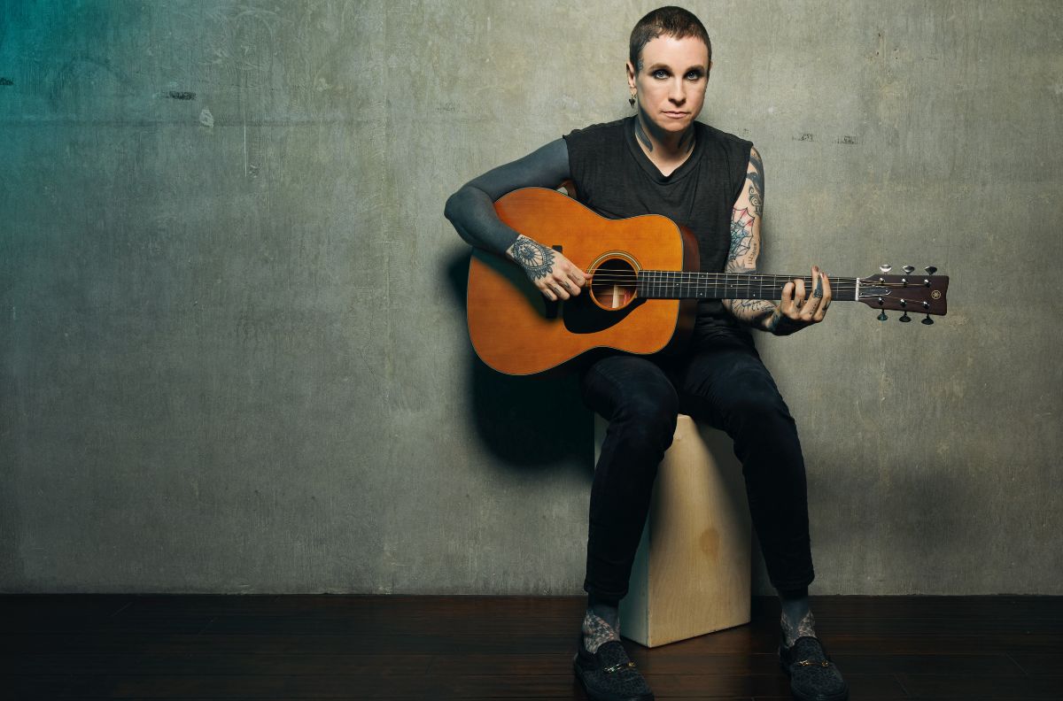 laura jane grace seated with guitar, photo by travis shinn